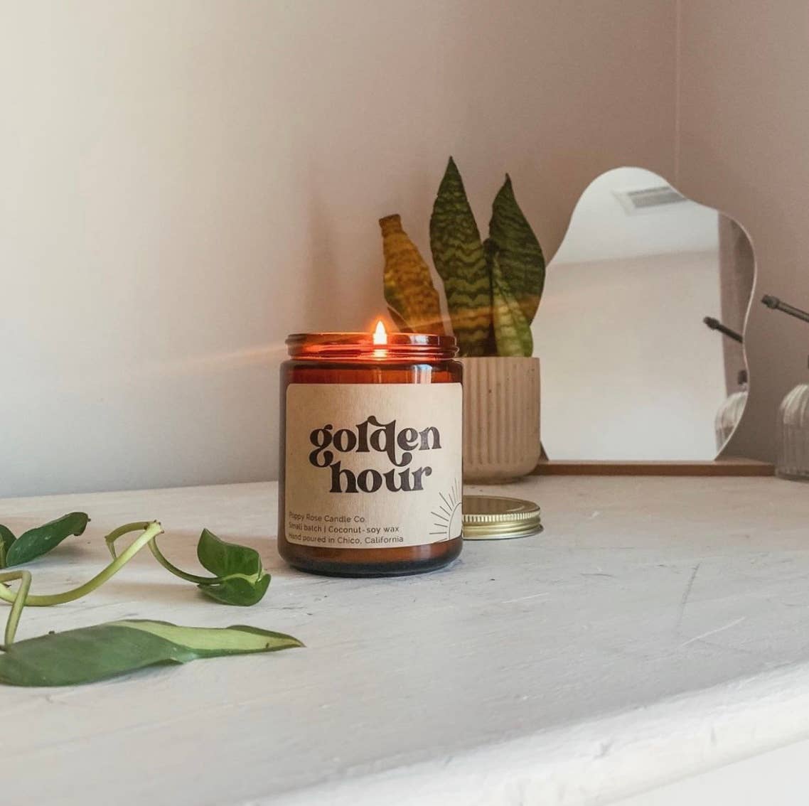 golden hour coconut wax candle in an amber glass jar