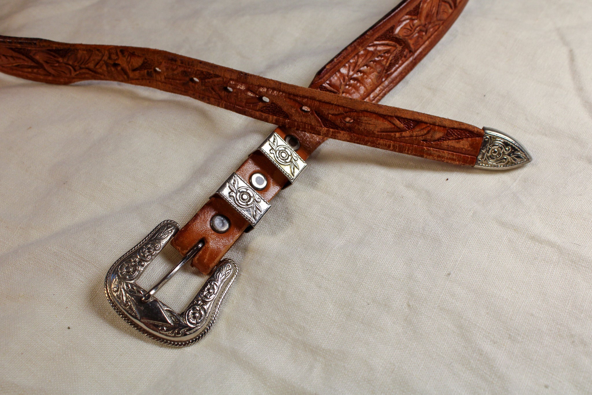 tooled leather belt w/ floral western buckle