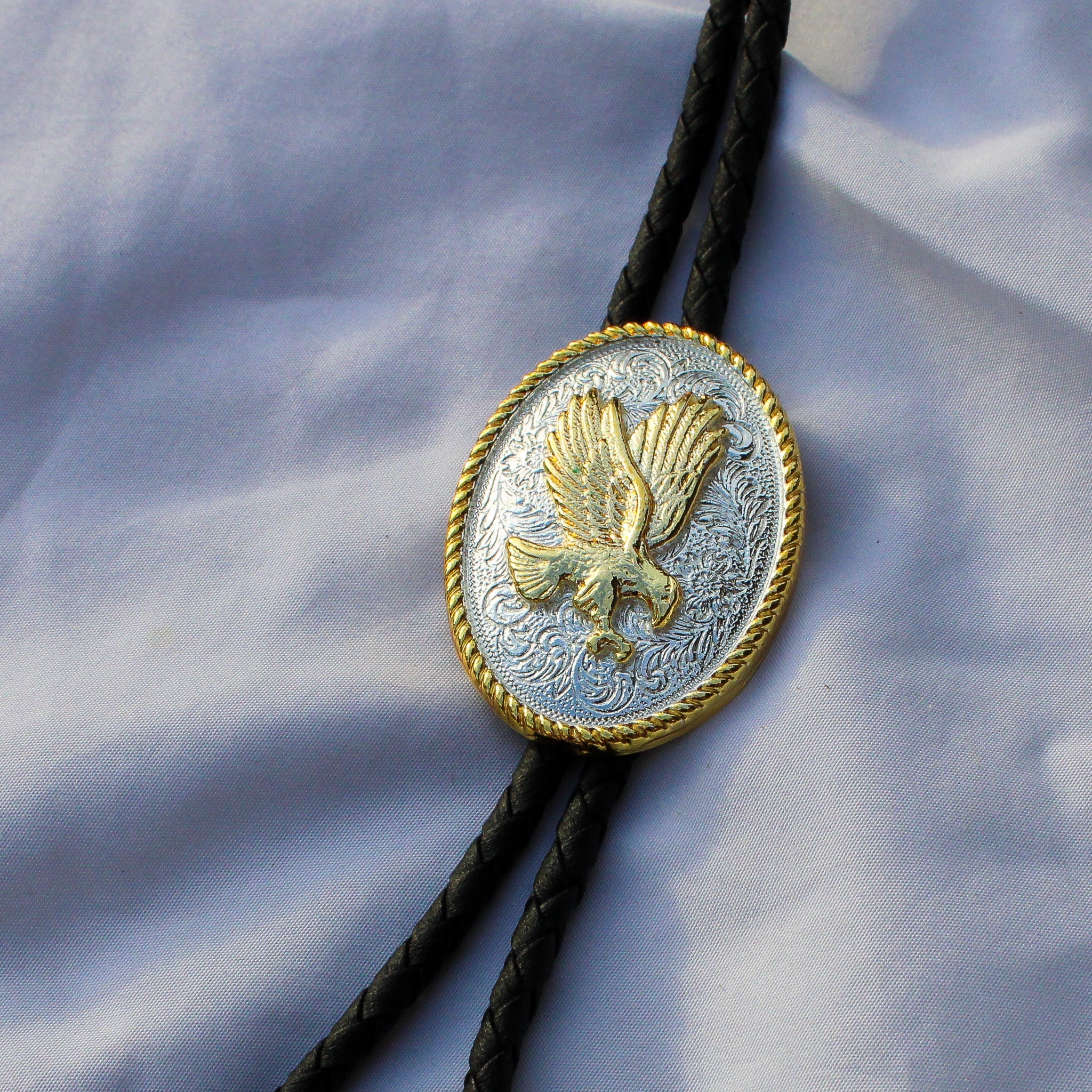 Close up of Nan two tone eagle bolo slide
