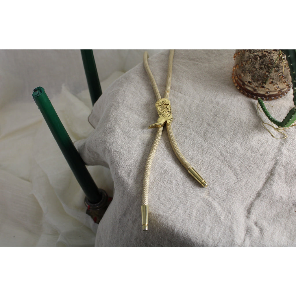 80s gold cowboy boot bolo tie