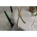 80s gold cowboy boot bolo tie