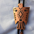 Copper thunderbird bolo tie tips and braided cord detail
