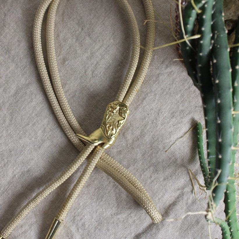 80s gold cowboy boot bolo tie