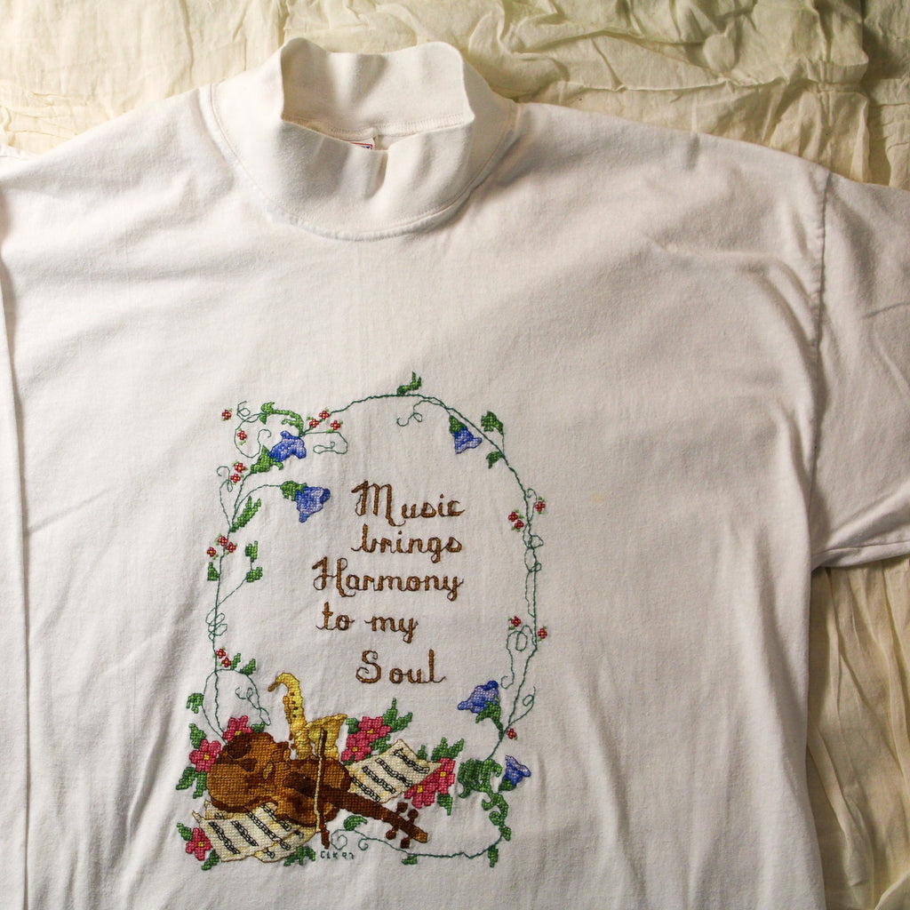 90s decosport mock-neck “music brings harmony”