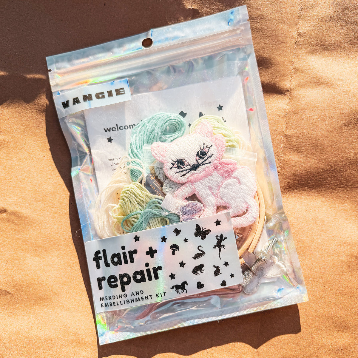 flair + repair kit for visible mending:  the cat's meow
