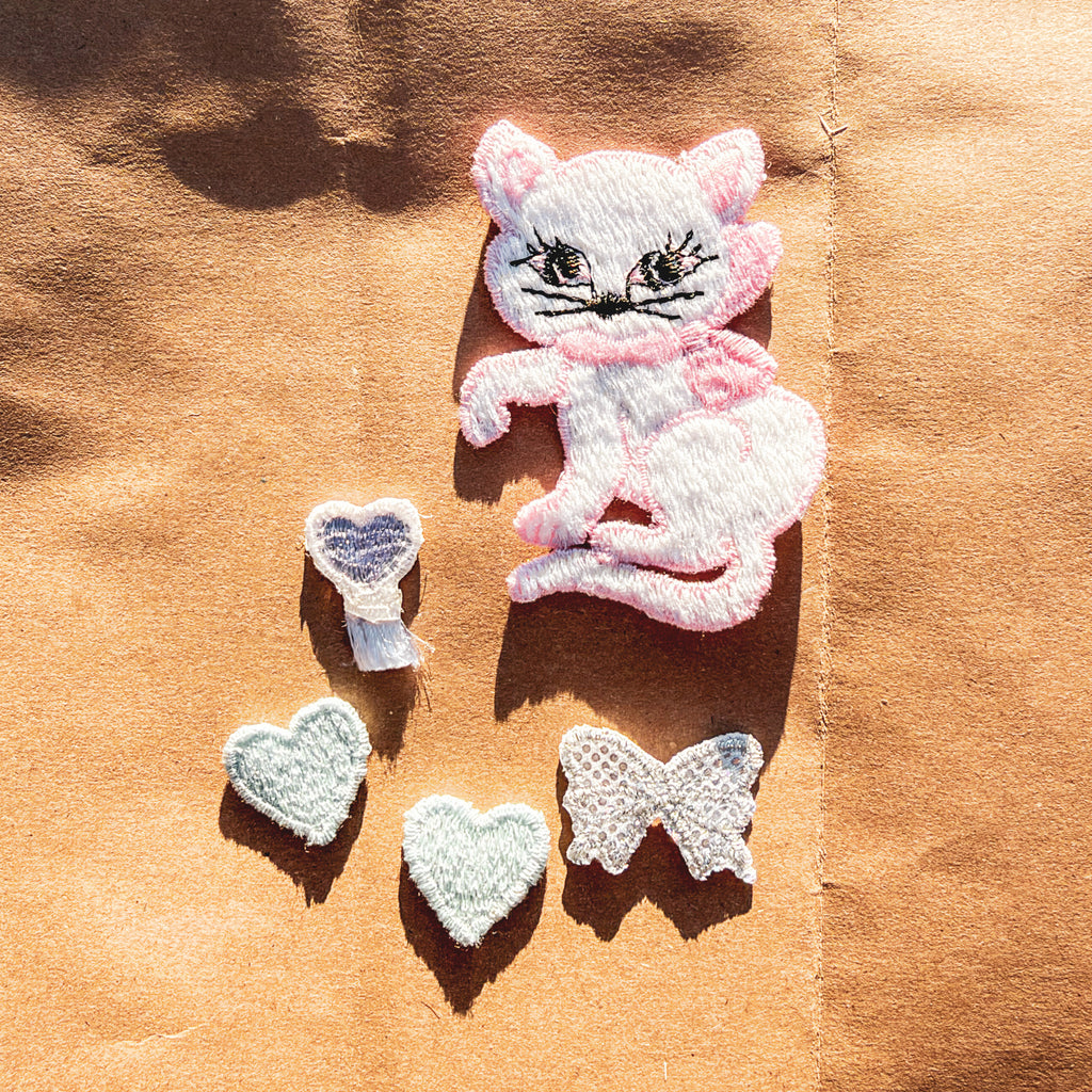 flair + repair kit for visible mending:  the cat's meow