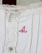 antique linen chemise, hand-monogrammed with mother-of-pearl buttons