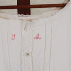 antique linen chemise, hand-monogrammed with mother-of-pearl buttons