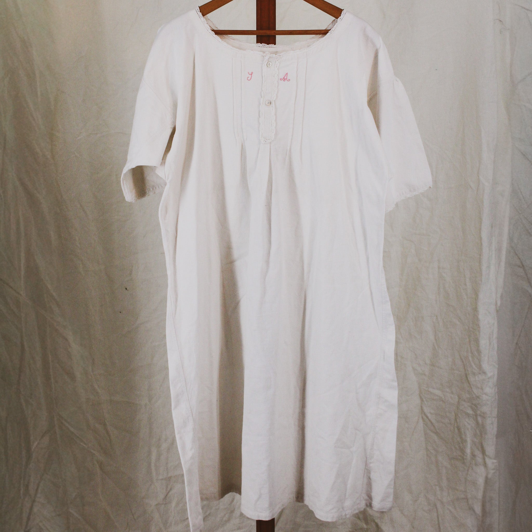 antique linen chemise, hand-monogrammed with mother-of-pearl buttons