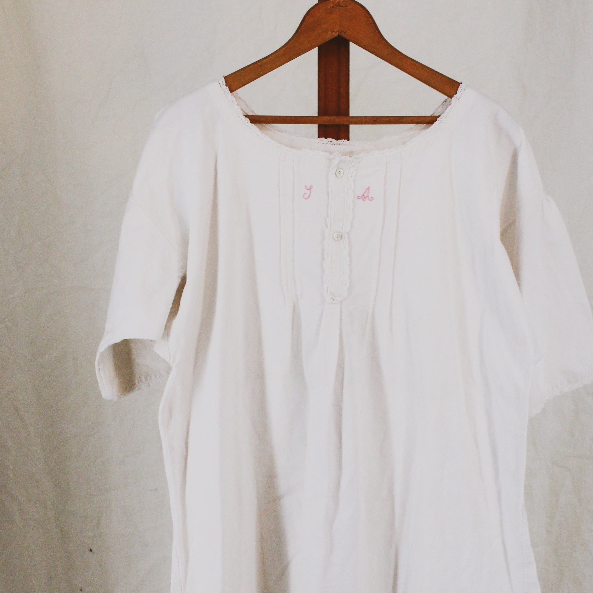 antique linen chemise, hand-monogrammed with mother-of-pearl buttons