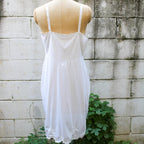 50s artemis white nylon slip - front bust detail on dress form