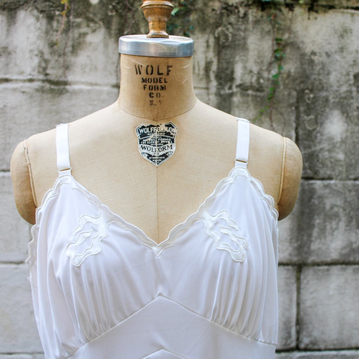 50s artemis white nylon slip - back view on dress form
