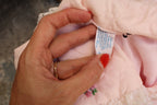 70s pink quilted bed jacket - care tag closeup