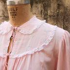 50s eastern isles pink chiffon bed jacket - front view on dress form