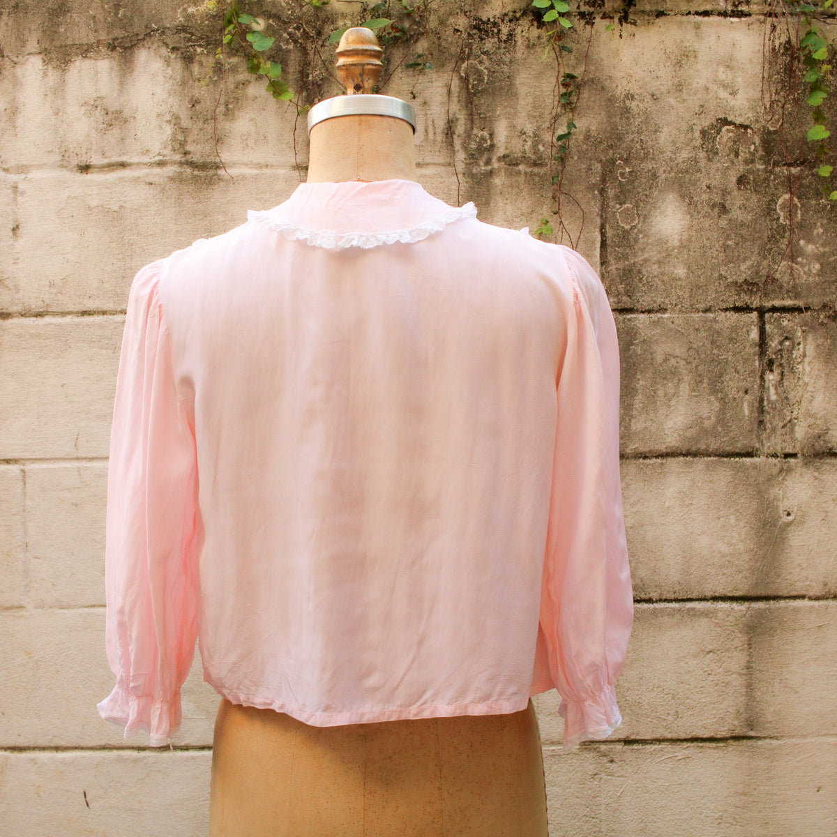50s eastern isles pink chiffon bed jacket - back view on dress form