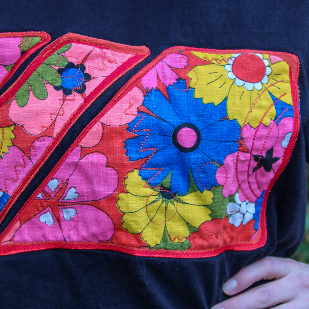 60s floral textile appliqué black tee - one-of-a-kind rework