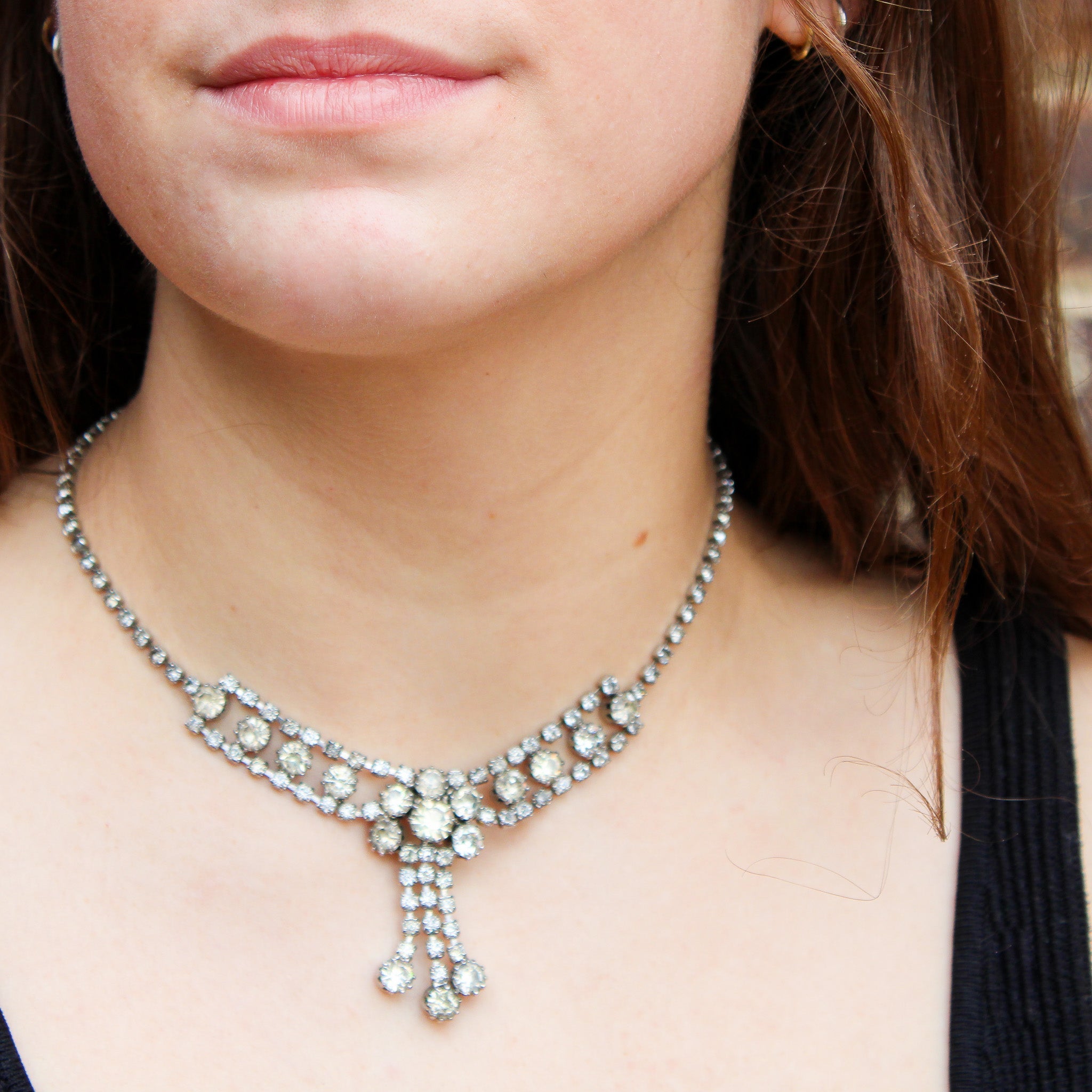 Detail view of rhinestone fringe choker