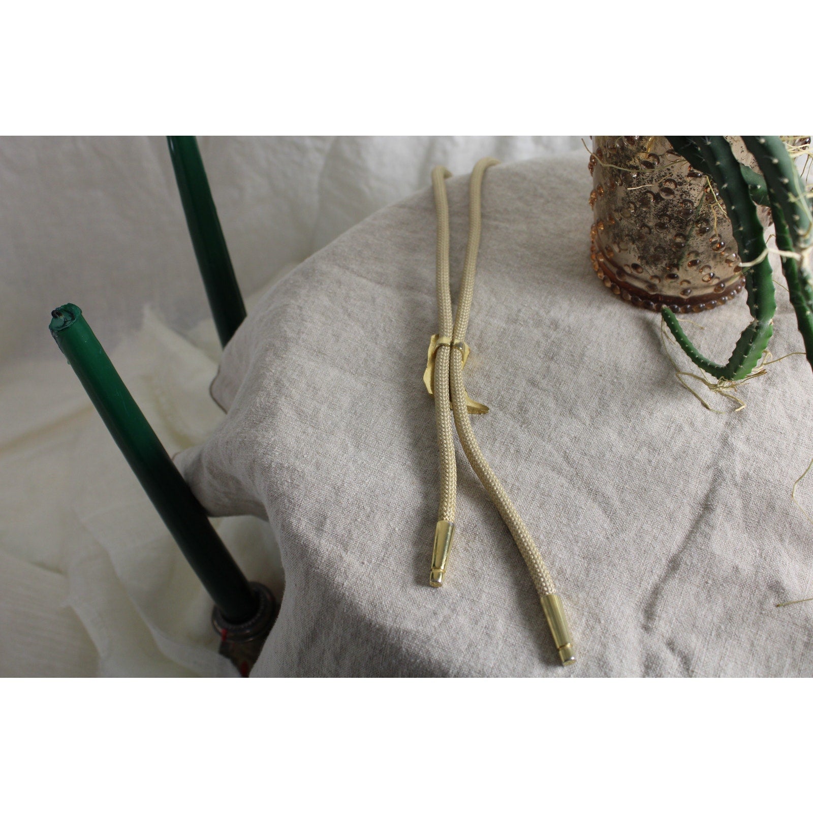 80s gold cowboy boot bolo tie