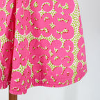 pink swirl print and pintucked hem detail