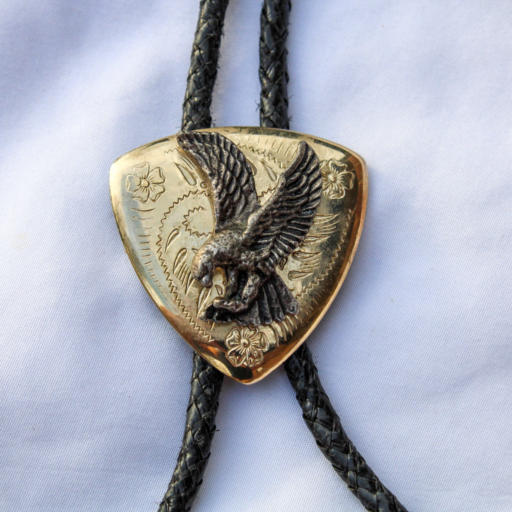Close up of 70s brass eagle bolo tie slide