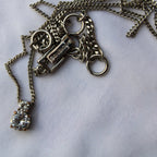 Detail view of Givenchy pendant