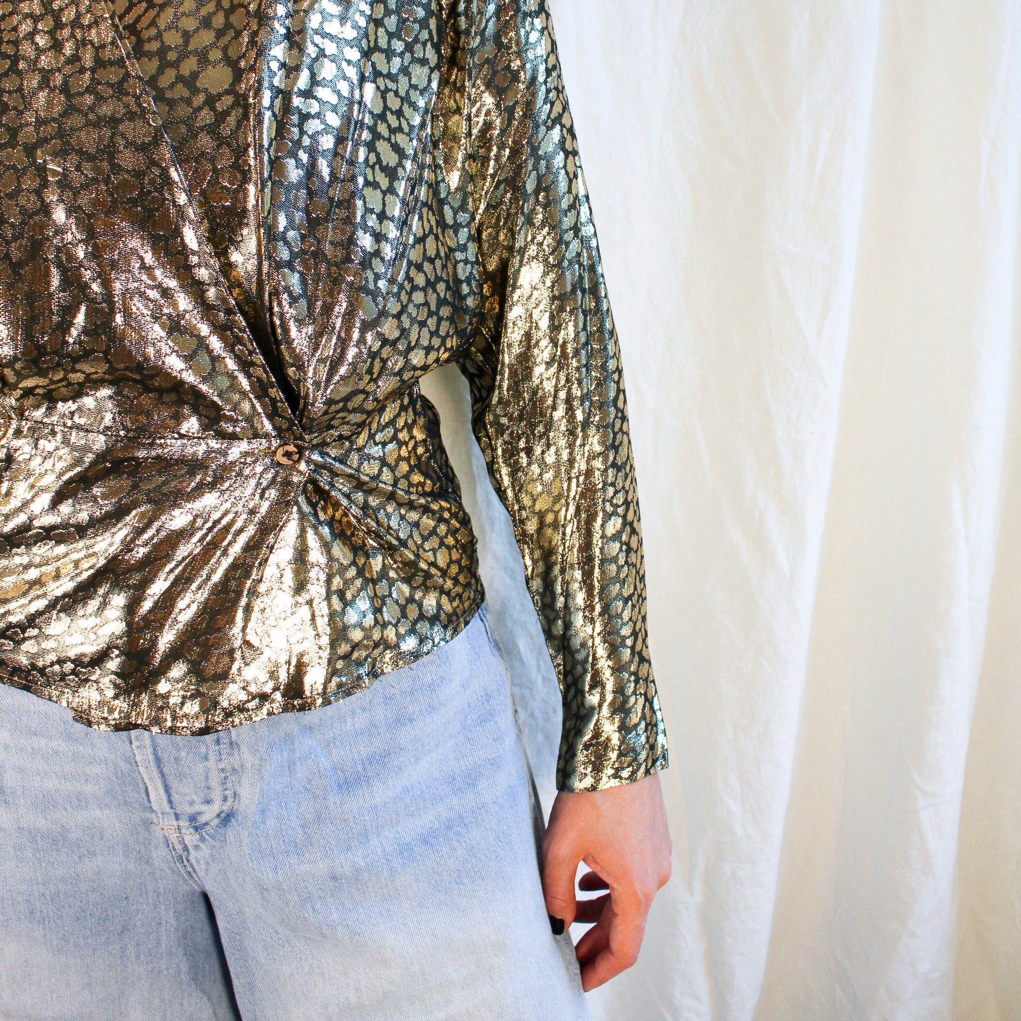 Side ruching ring detail close-up