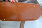 leather base showing scratches and scuffs