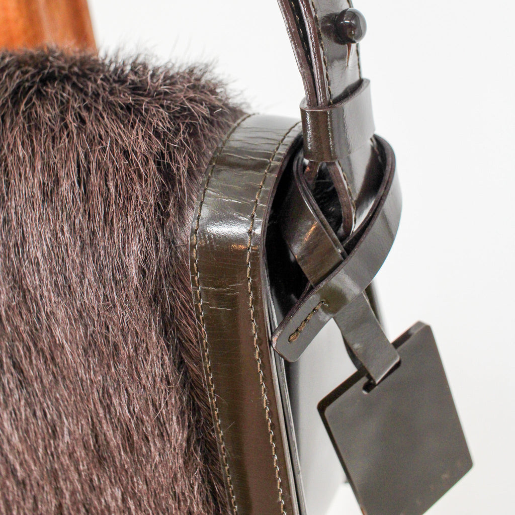side profile with strap buckle and tag