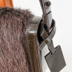 side profile with strap buckle and tag