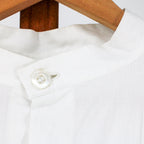 stand collar and mother-of-pearl neck button