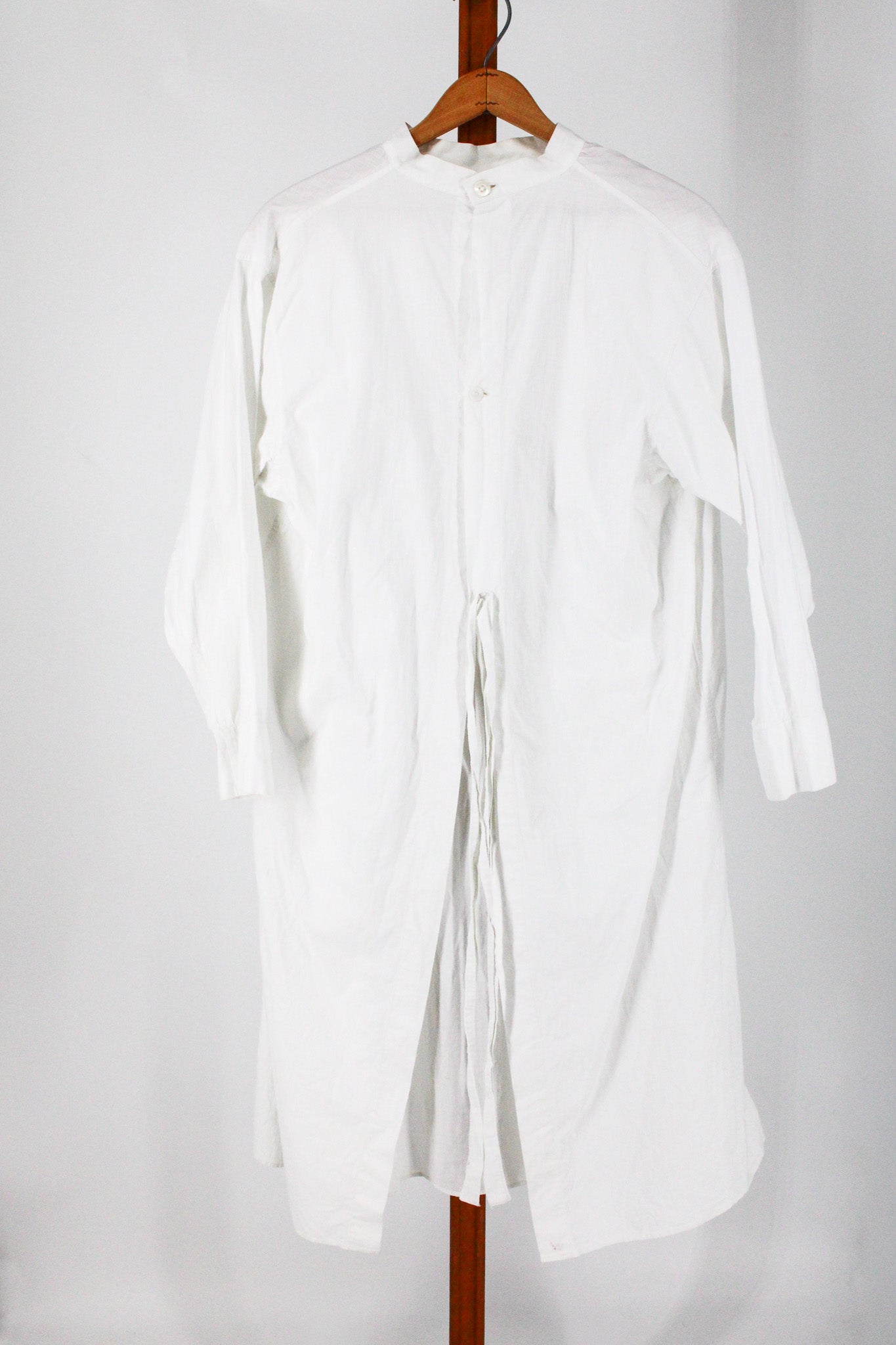 full front showing bib placket and ties