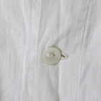 mother-of-pearl placket button and hand-worked buttonhole