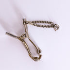 figural hand sweater clip, open