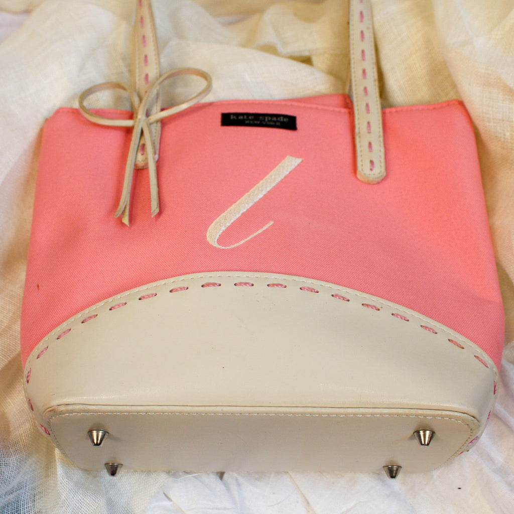 early 2000s kate spade new york pink monogram “l” tote bag with leather base, handles, and bow