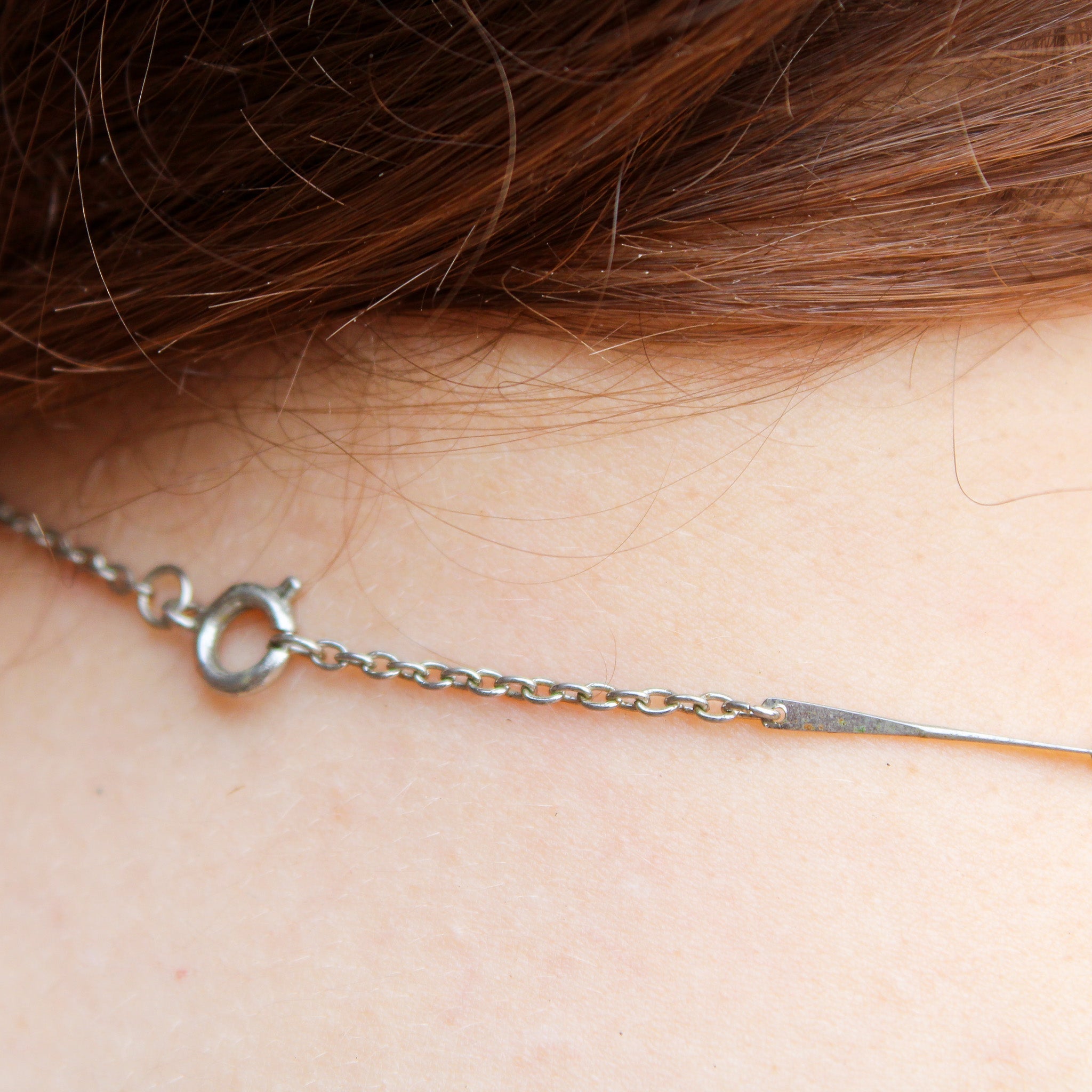 Front view of enamel heart bead choker