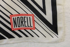 vintage norman norell “n” graphic silk scarf – black & white with red logo