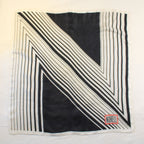 vintage norman norell “n” graphic silk scarf – black & white with red logo