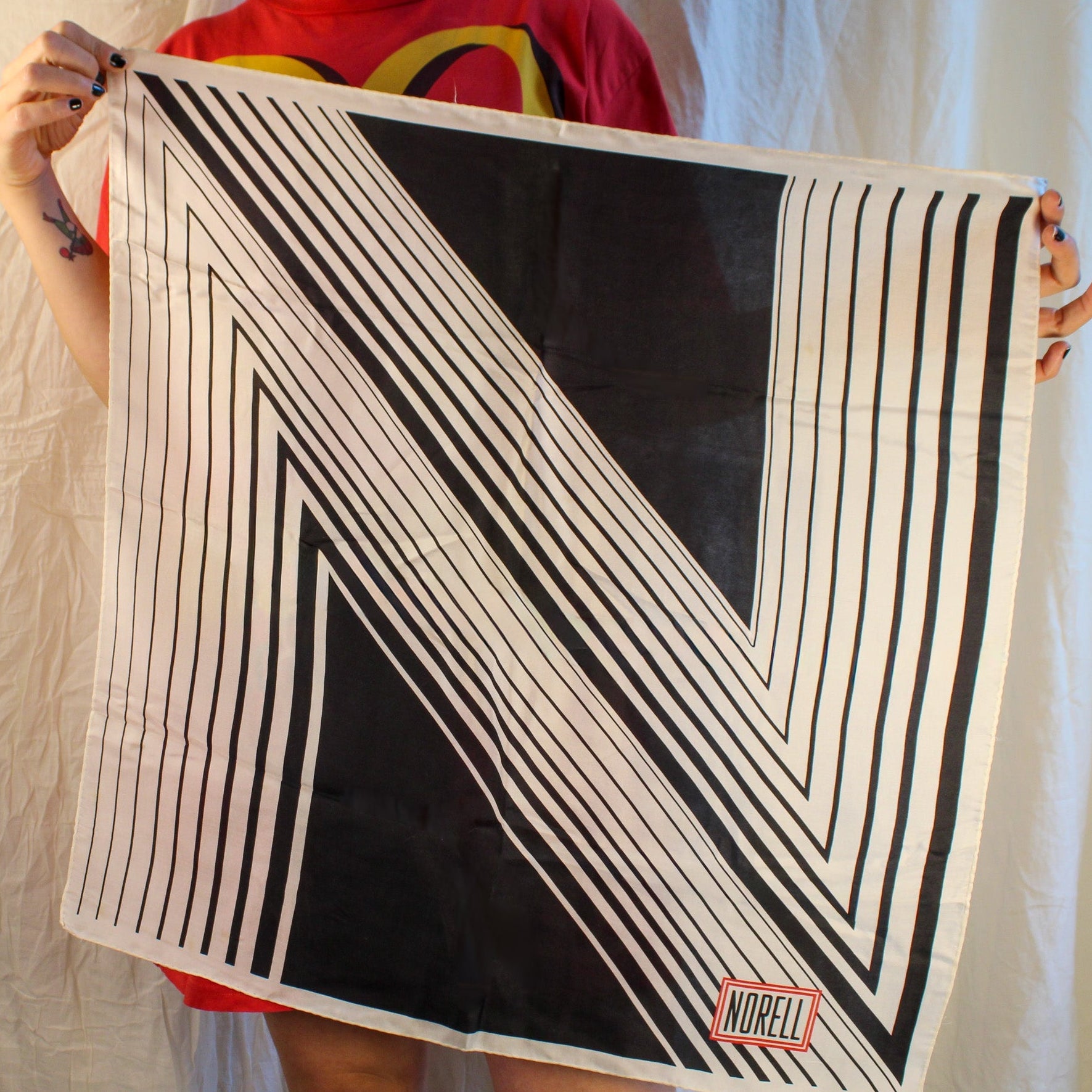 vintage norman norell “n” graphic silk scarf – black & white with red logo