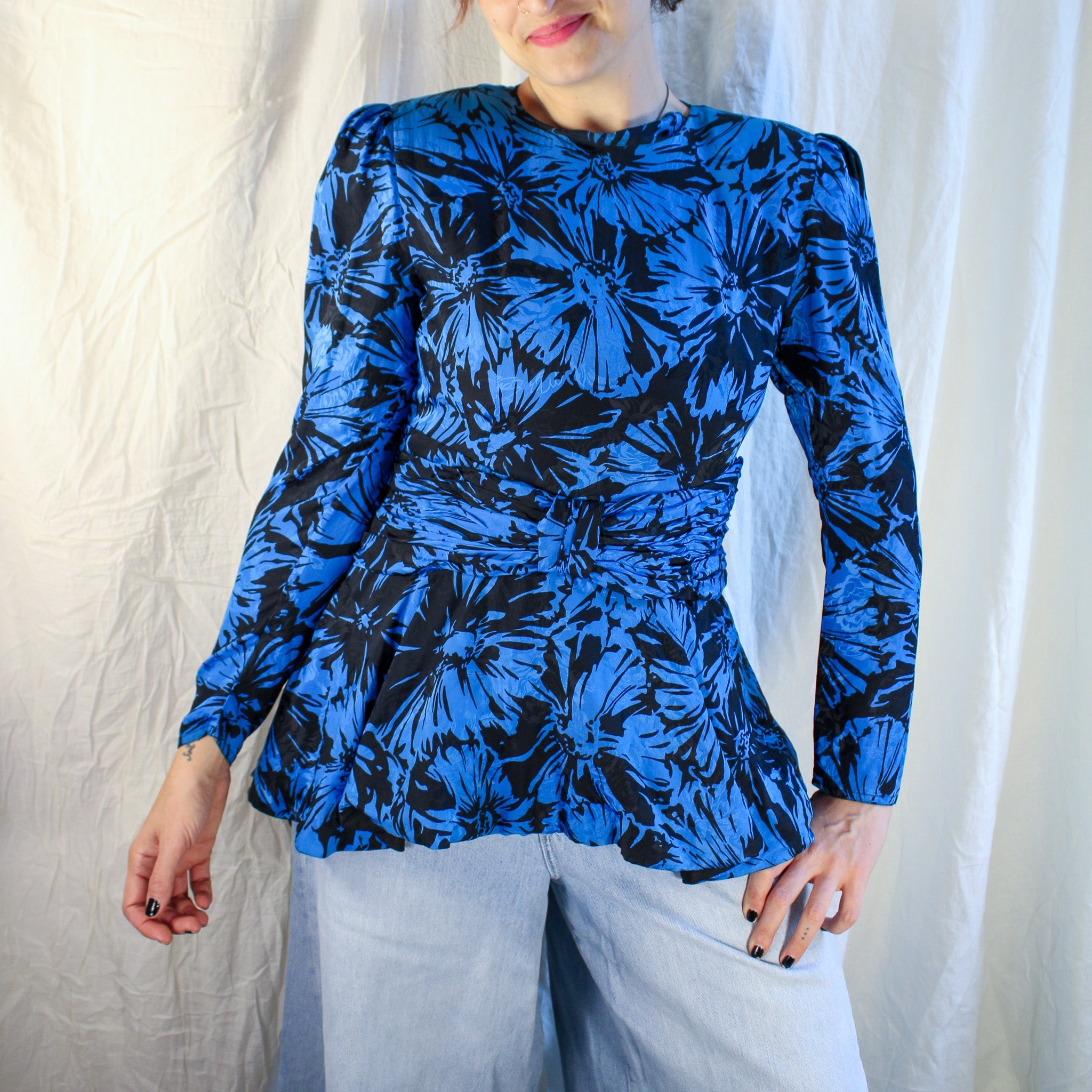 Front on model silk peplum blouse