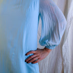 Close-up of crepe body and sheer sleeve