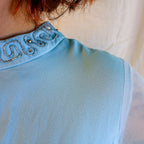 Detail of beaded mock neck