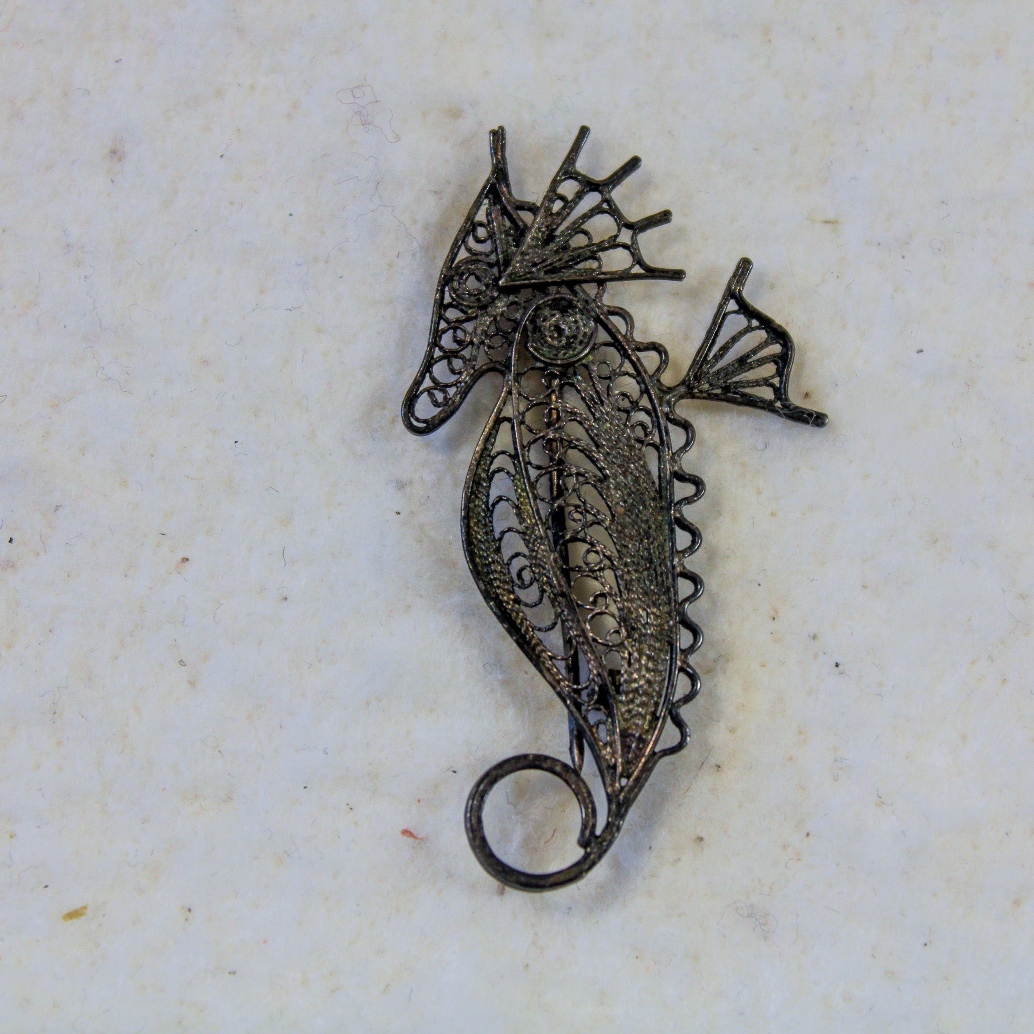 Front close-up of seahorse brooch