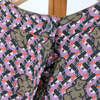 back neck button and teddy bear print detail