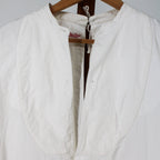 stand collar, neck tie, and bib bosom detail
