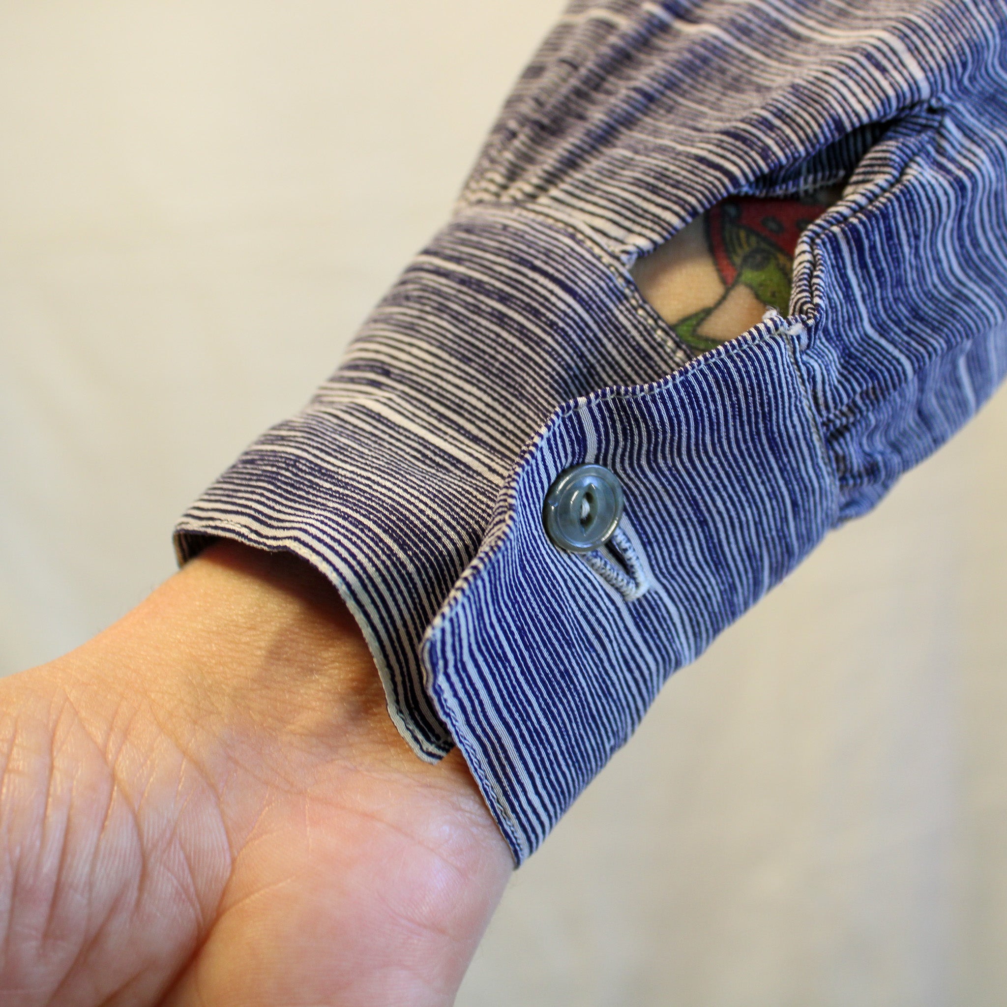 Front view on model of Geoffrey Beene striped silk blouse