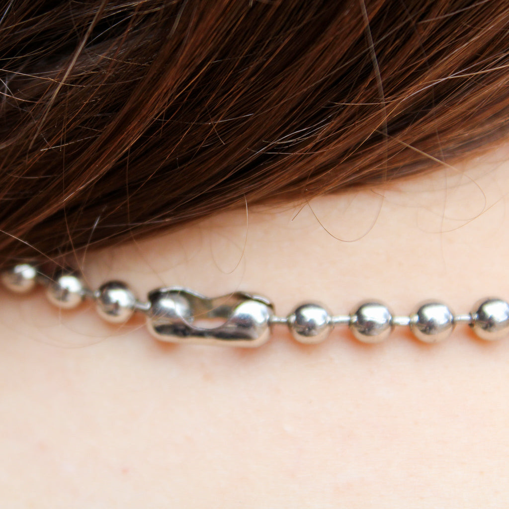 Front view of silver ball chain choker on model