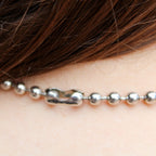 Front view of silver ball chain choker on model