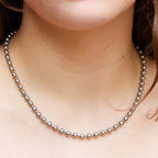 Detail of barrel clasp on silver ball chain choker