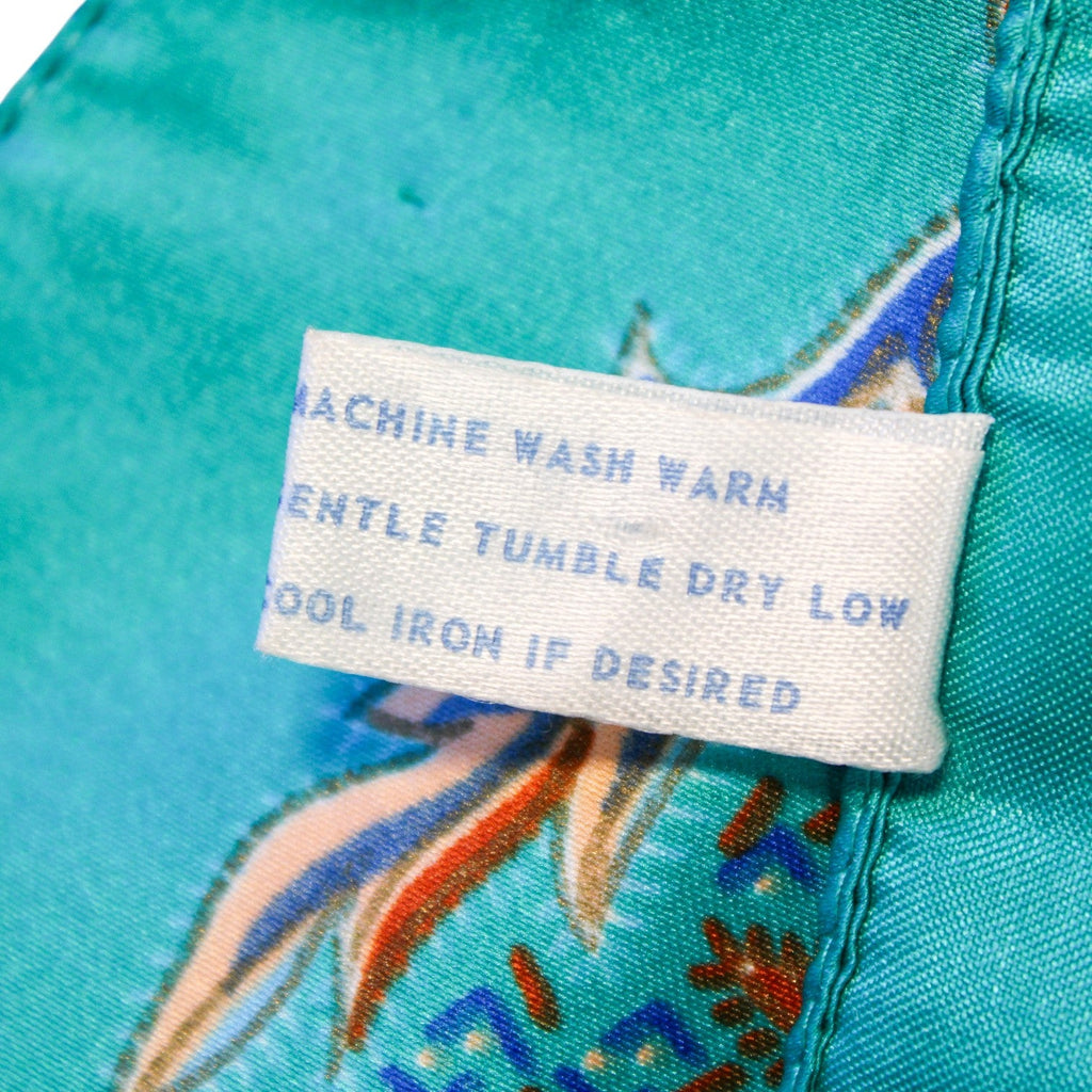 Full layout view of teal paisley scarf