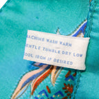 Full layout view of teal paisley scarf